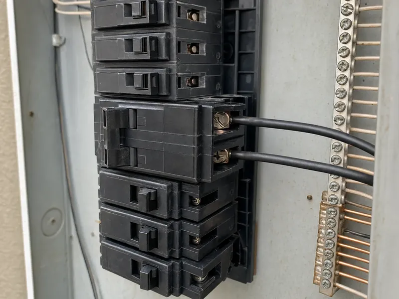 The dedicated two-pole 60-amp breaker feeding a heat pump conversion, landed on a load center with capacity confirmed by calculation