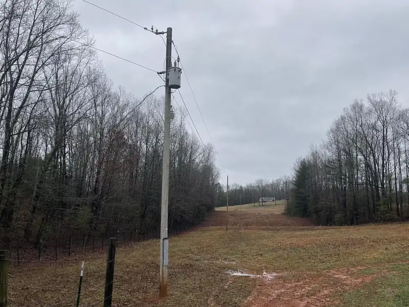 The long run from the nearest co-op pole to a rural Pickens County house, the lead item on any acreage service upgrade