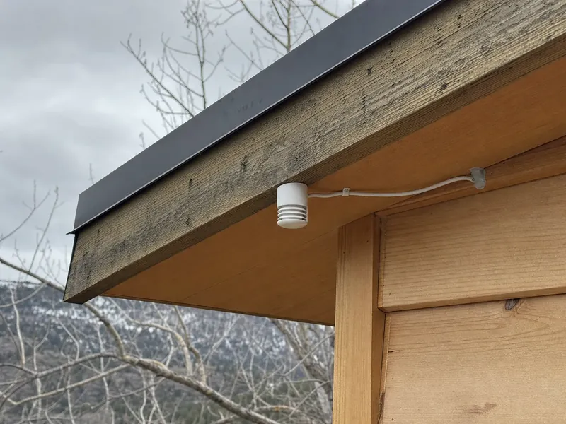 The outdoor sensor and low-voltage wiring that set a dual-fuel system's switchover temperature on a Jasper area mountain home