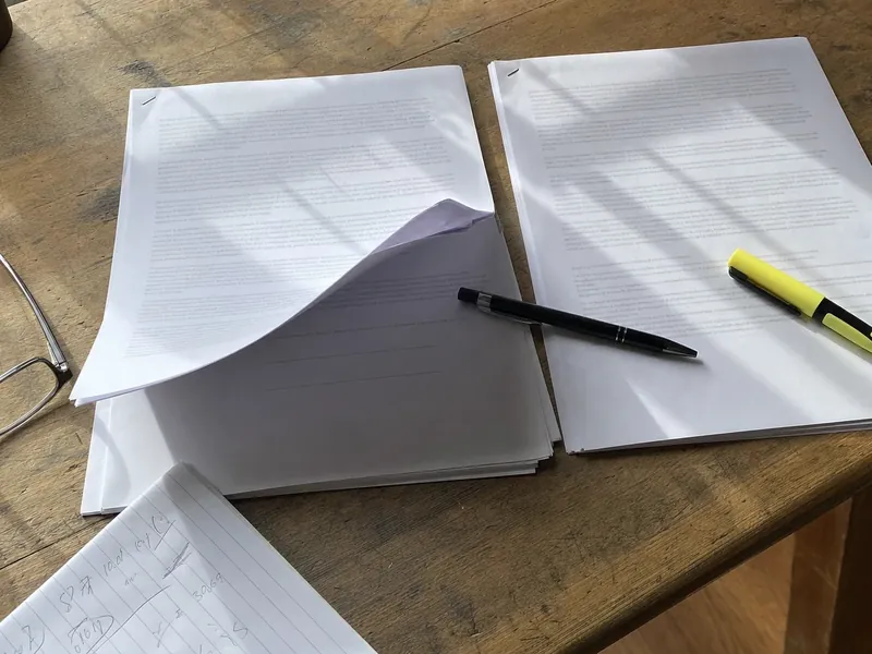 A propane supply agreement and separate tank lease laid out for review before a North Georgia homeowner gives notice to convert
